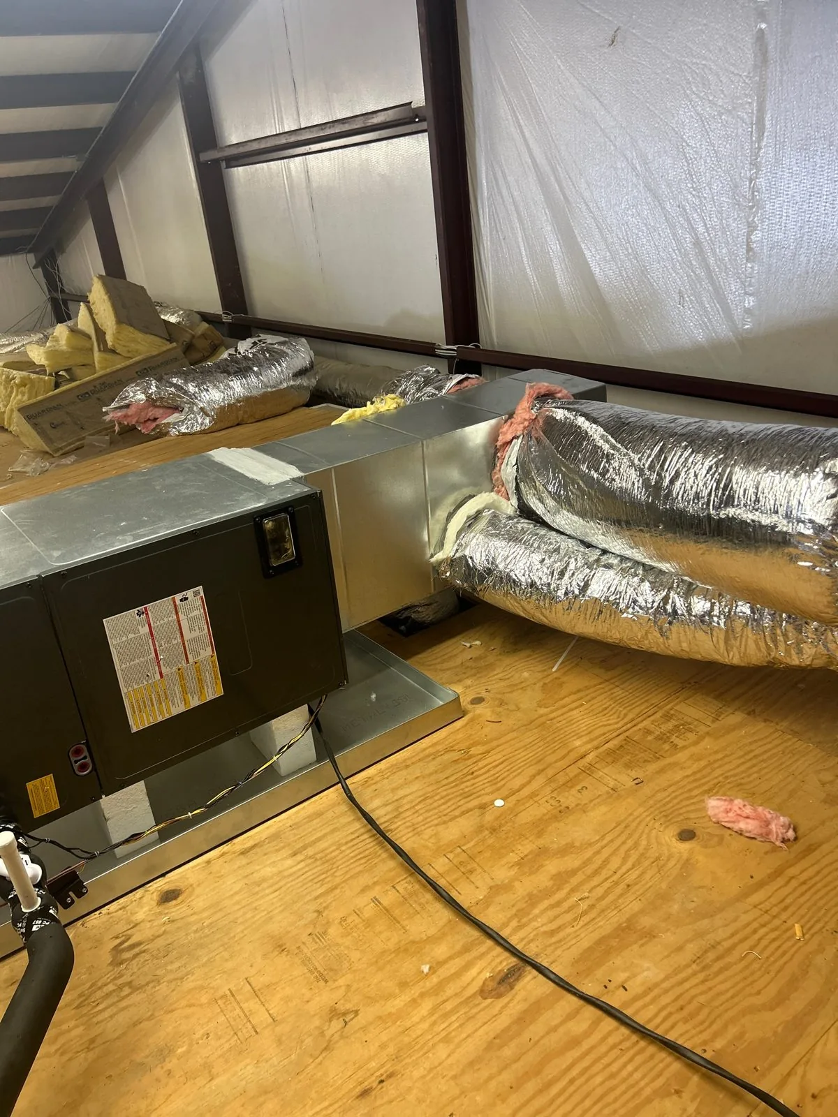 New air handler on a raised platform with sealed duct connections