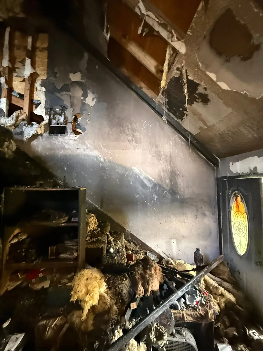 Fire-damaged stairway during demolition